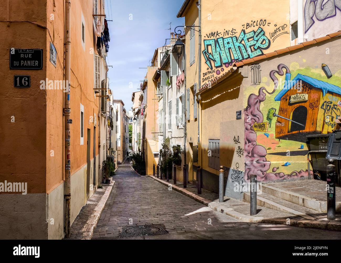 Marseille, France, May 2022, view of Rue des Cordelles a narrow street with mural in Le Panier district Stock Photo