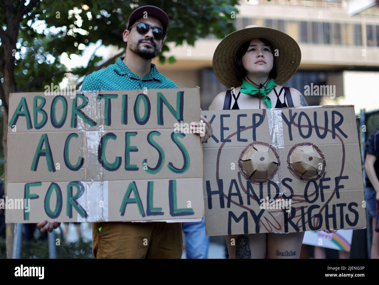 Kimberly Wildgor 29, and Steven Wildgor 28, hold signs during an abortion rights protest after the U.S. Supreme Court ruled in the Dobbs v Women’s Health Organization abortion case, overturning the landmark Roe v Wade abortion decision in Los Angeles, California, U.S., June 27, 2022. REUTERS/Lucy Nicholson Stock Photo