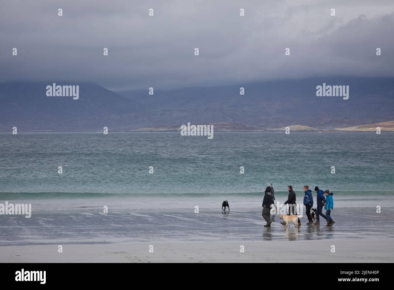 People walking their dogs at Luskentyre beach on the Isle of Harris, Outer Hebrides, Scotland, United Kingdom Stock Photo