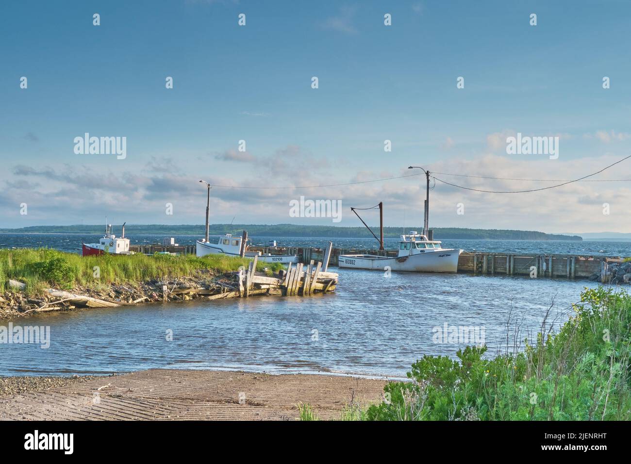 Fishing boats tied up for the evening in a small harbour in South Bar Nova Scotia. Stock Photo