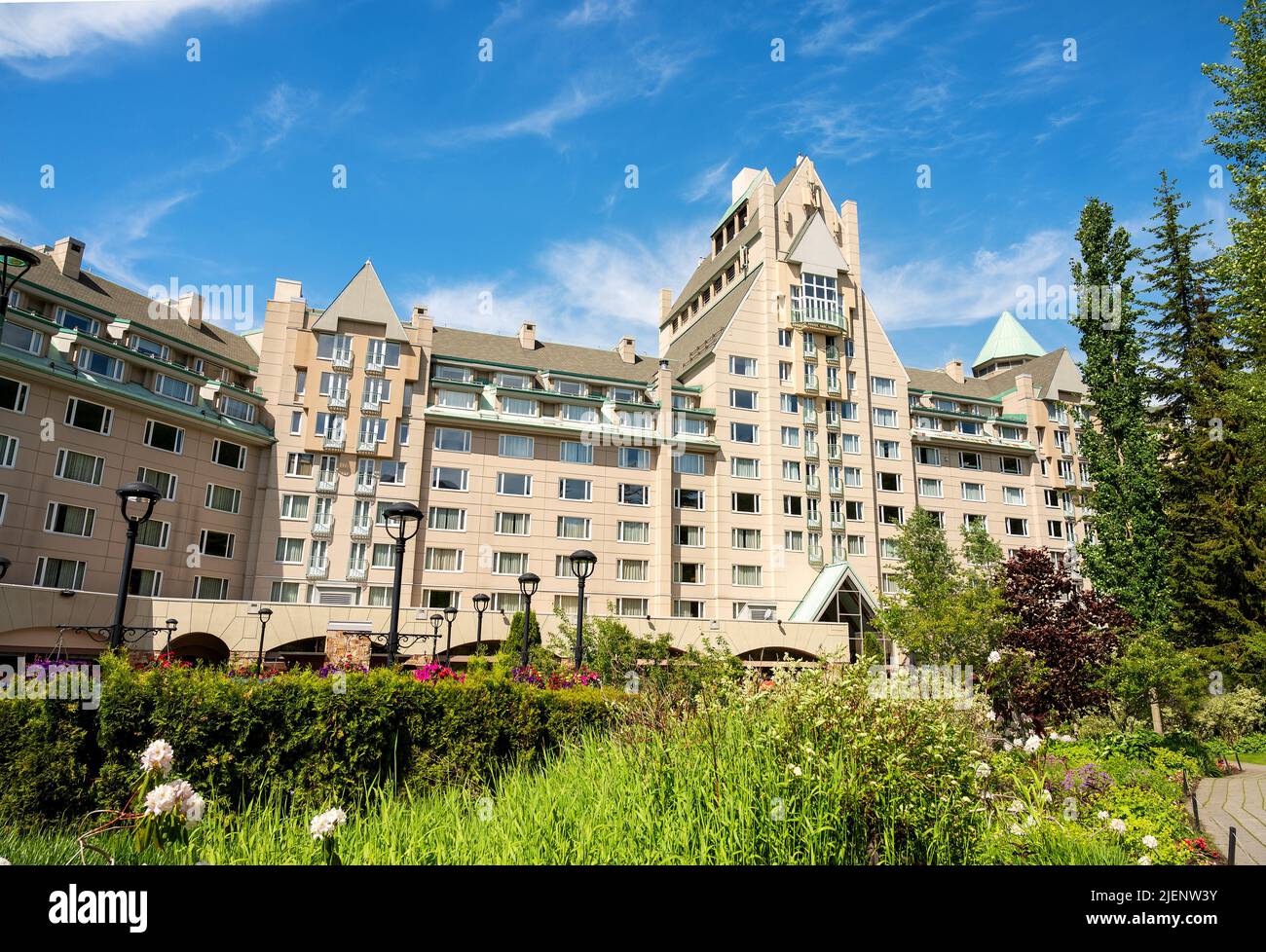 The Fairmont Chateau Report and Spa hotel in Whistler BC on a late summer day with a blue sky. Stock Photo