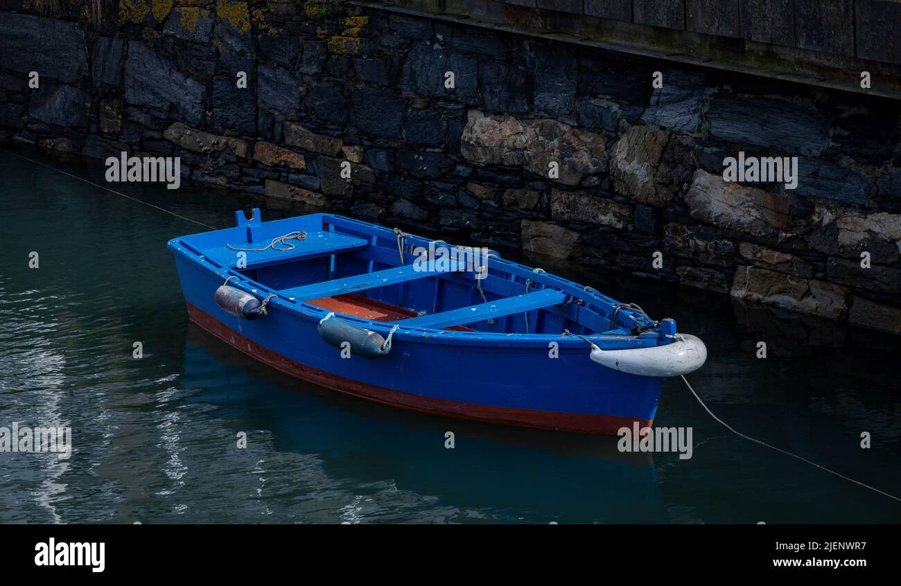 Small wooden boat moored at the fishing pier Stock Photo - Alamy