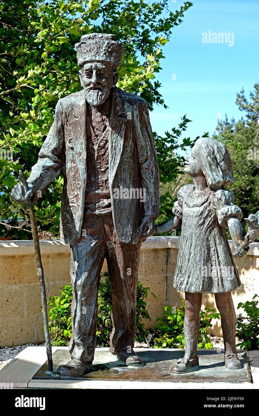 Statue of elderly veteran from the Turkish Army and a young girl at the 57th Infantry Memorial at Gallipoli in Turkey Stock Photo