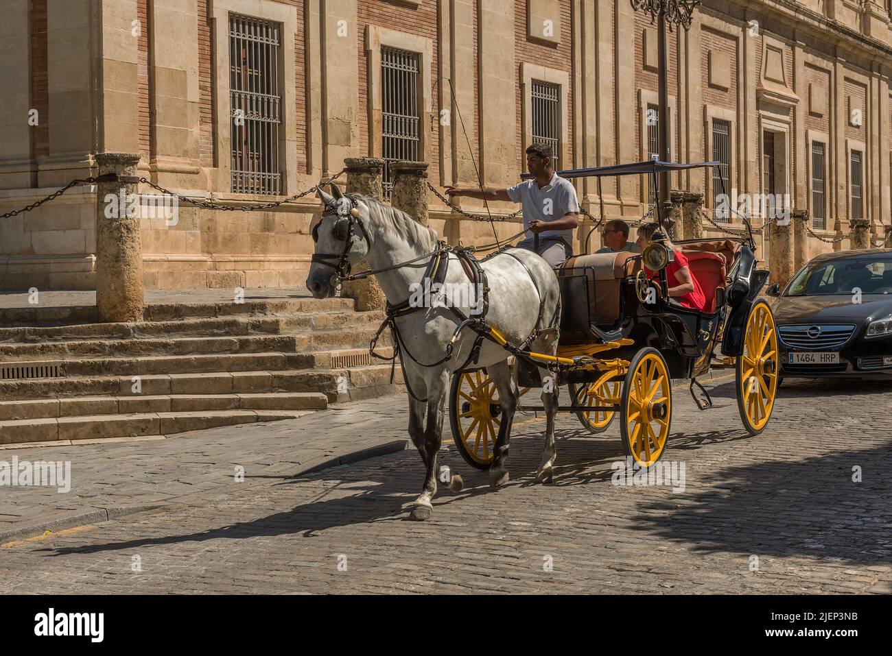 Typical horse carriage in the historical old town of Seville, Andalusia, Stock Photo