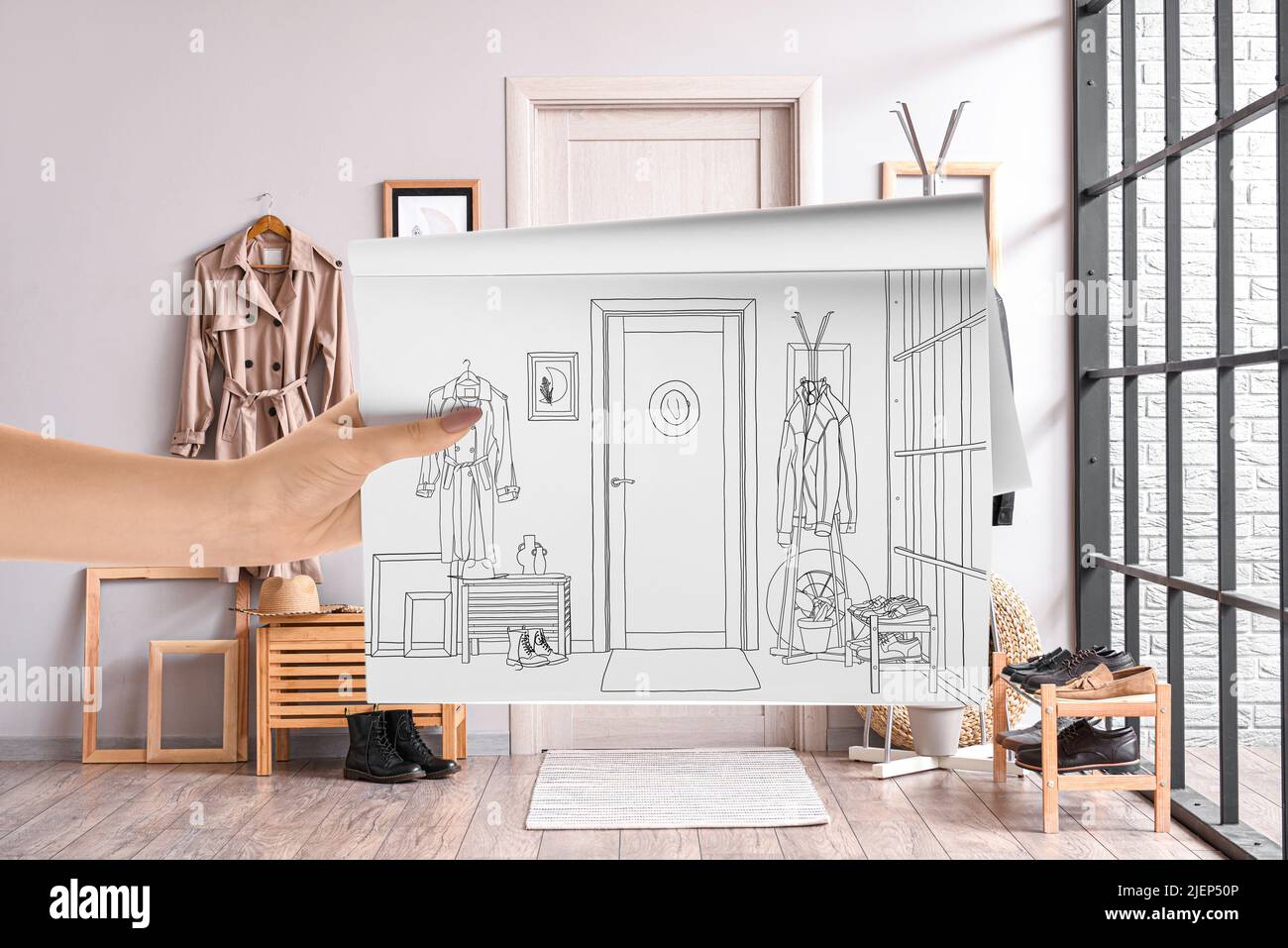 Designer holding sketchbook with drawing of new hallway interior Stock ...