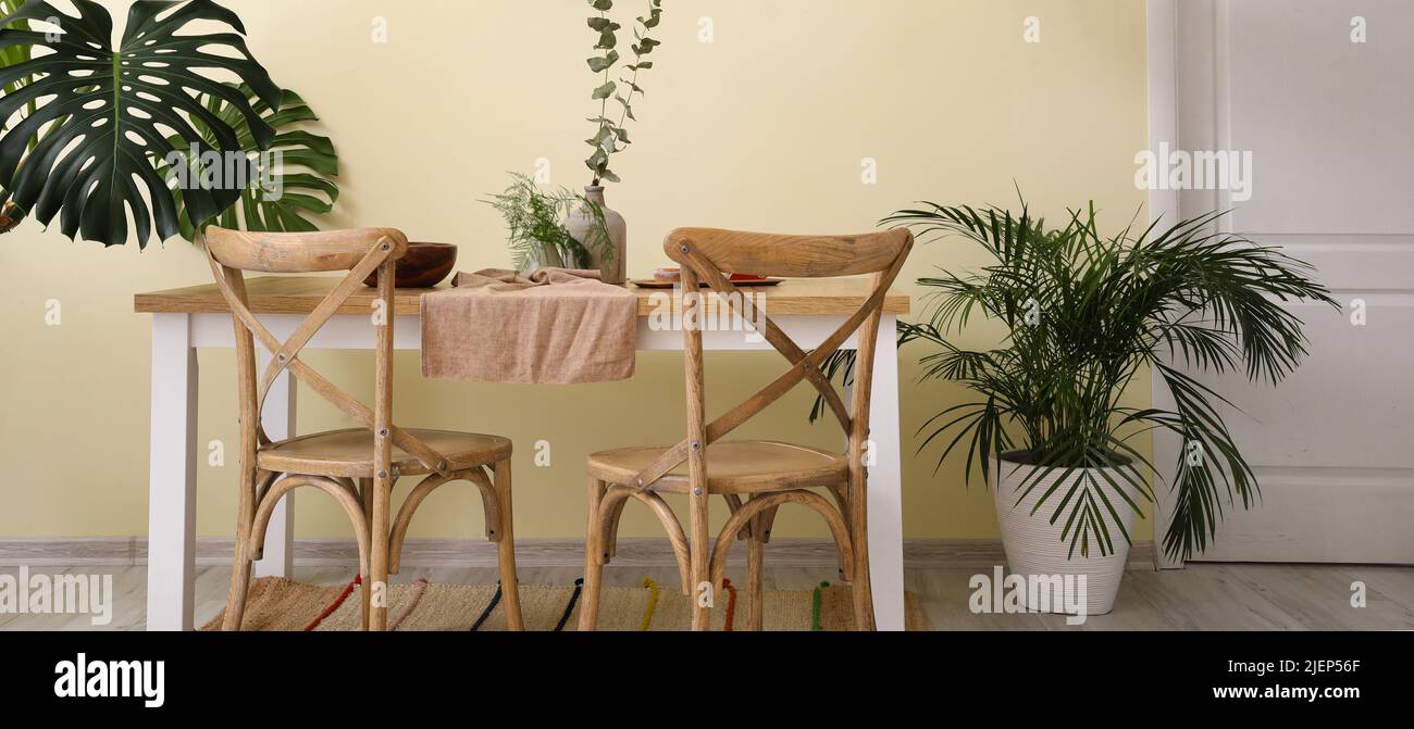 Interior of modern stylish dining room with tropical plants Stock Photo ...