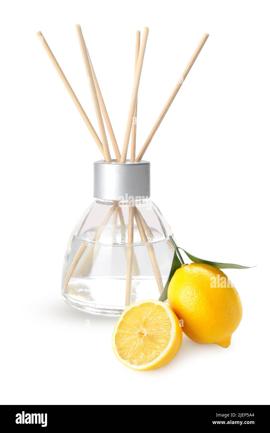 Reed diffuser and lemons on white background Stock Photo