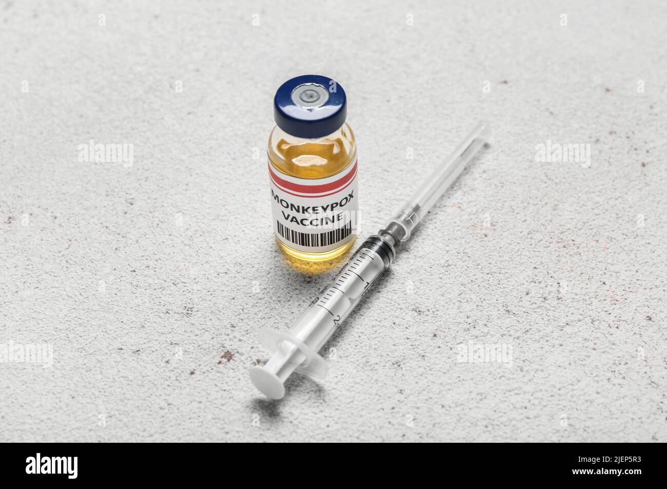 Monkeypox vaccine and syringe on light background Stock Photo - Alamy