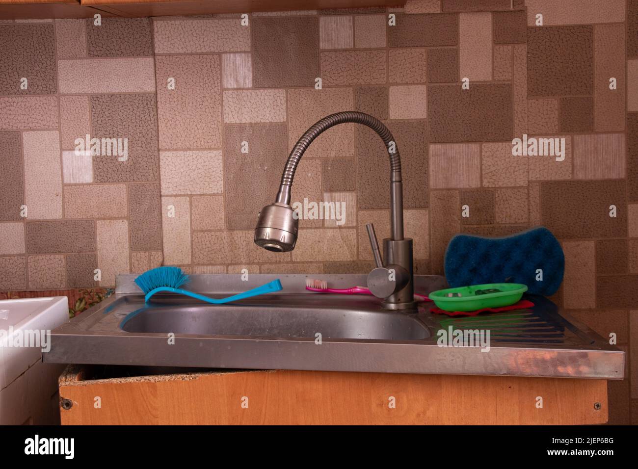 Soviet apartment, kitchen sink in the kitchen, broken bedside table