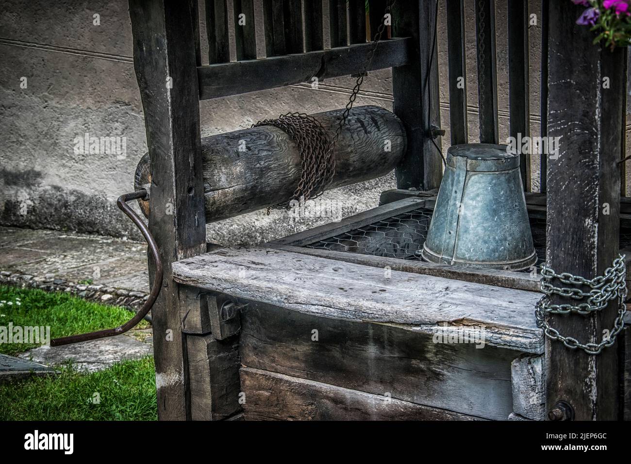 A metal bucket and other details of an old well Stock Photo
