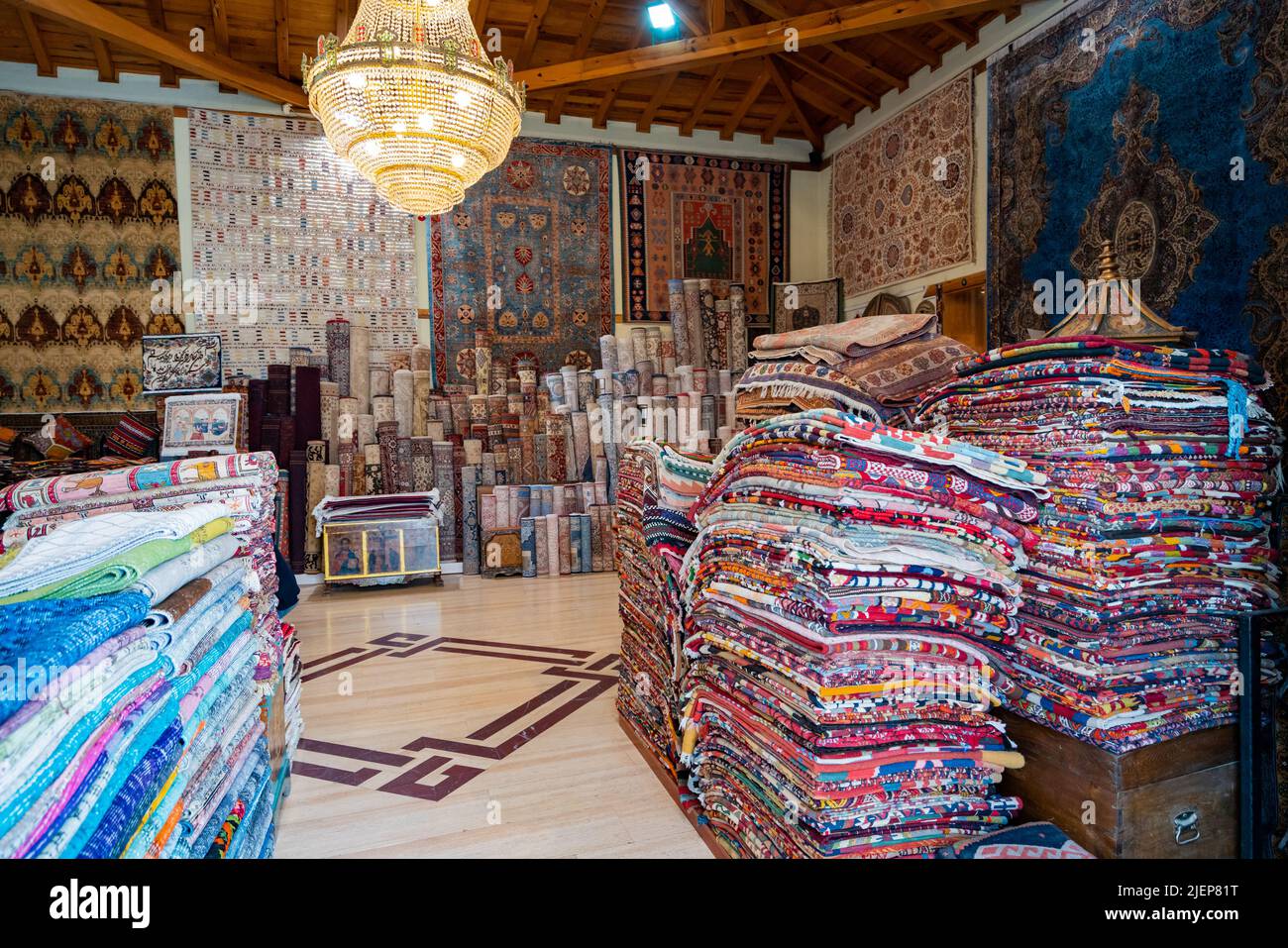 RolledUp Carpets In A Variety Of Colors In A Carpet Store Stock Photo