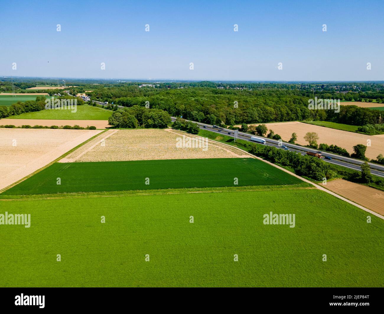 Farmland from above. Aerial view over green fields Stock Photo