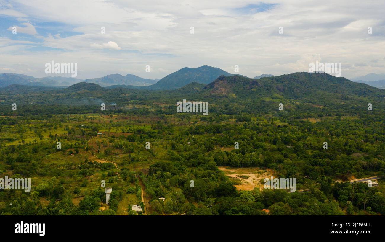 Tropical landscape: A rural area with agricultural lands and farmers ...