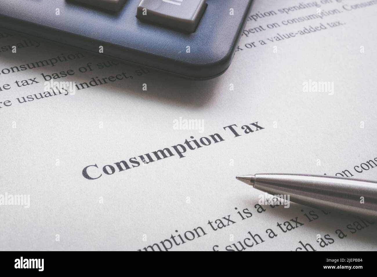 Info about consumption tax and a pen. Stock Photo