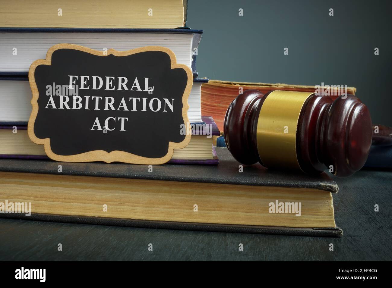 Pile of books and gavel. Federal arbitration act concept. Stock Photo