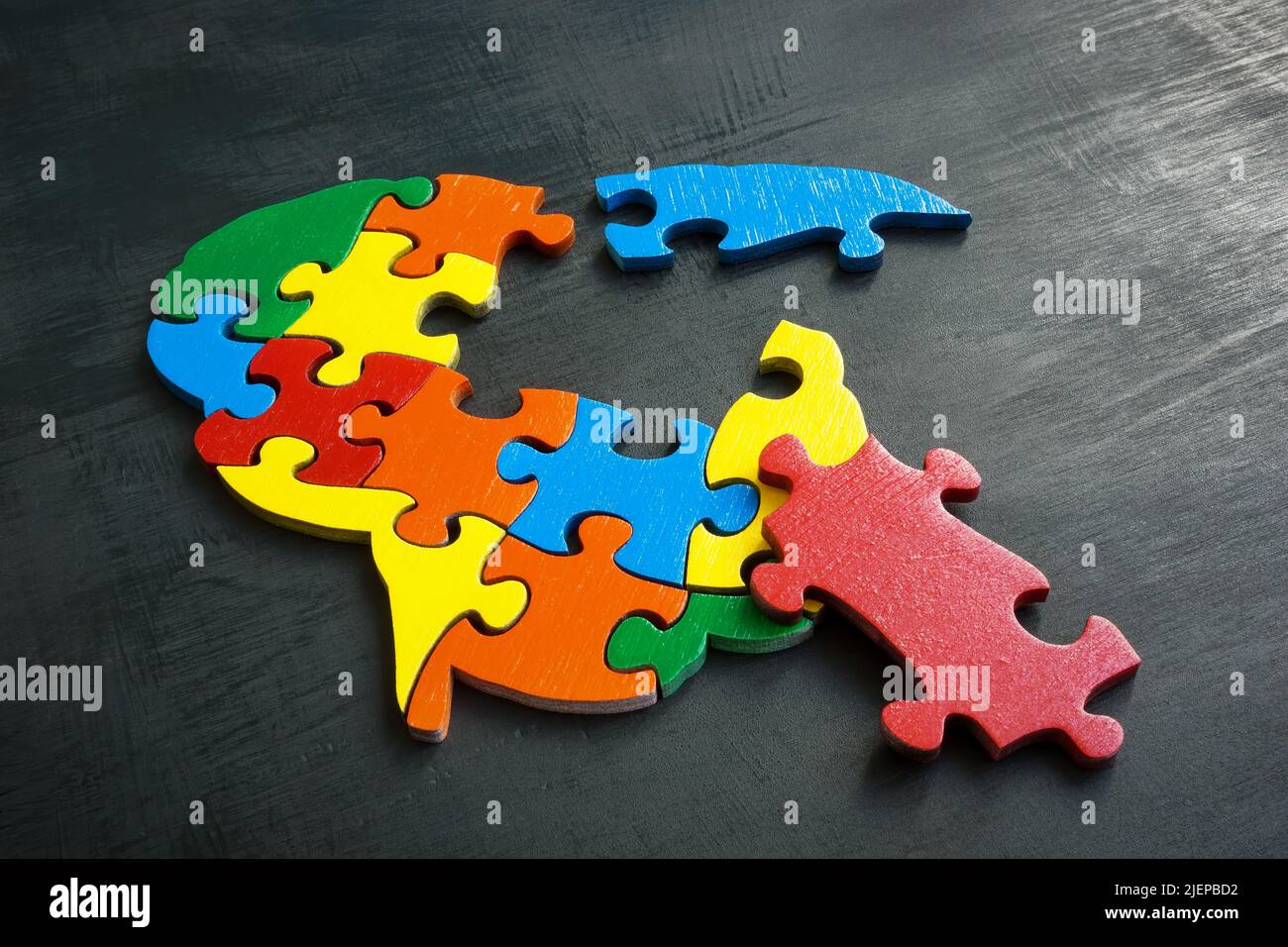 Brain from colored puzzle pieces. Mental disorder concept. Stock Photo