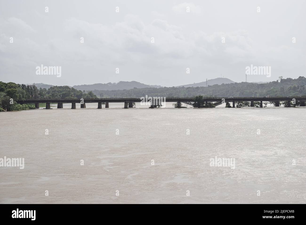 Railway bridge through a river in India Stock Photo