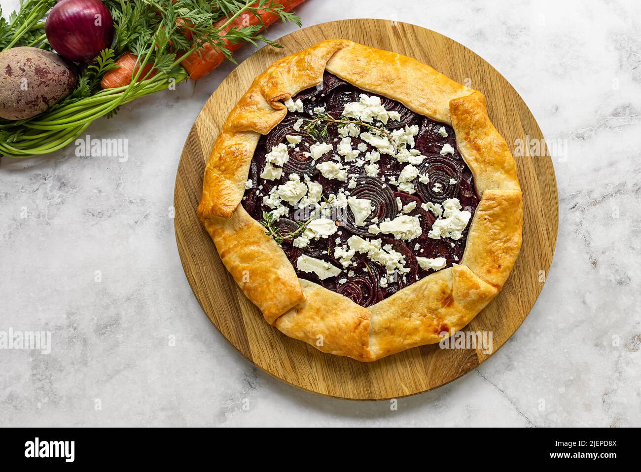Savory root vegetable galette. Served with goat cheese Stock Photo Alamy