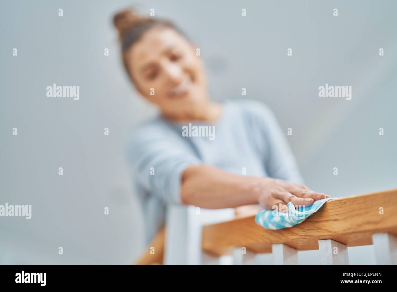 Picture of woman cleaning stair steps or railing Stock Photo Alamy