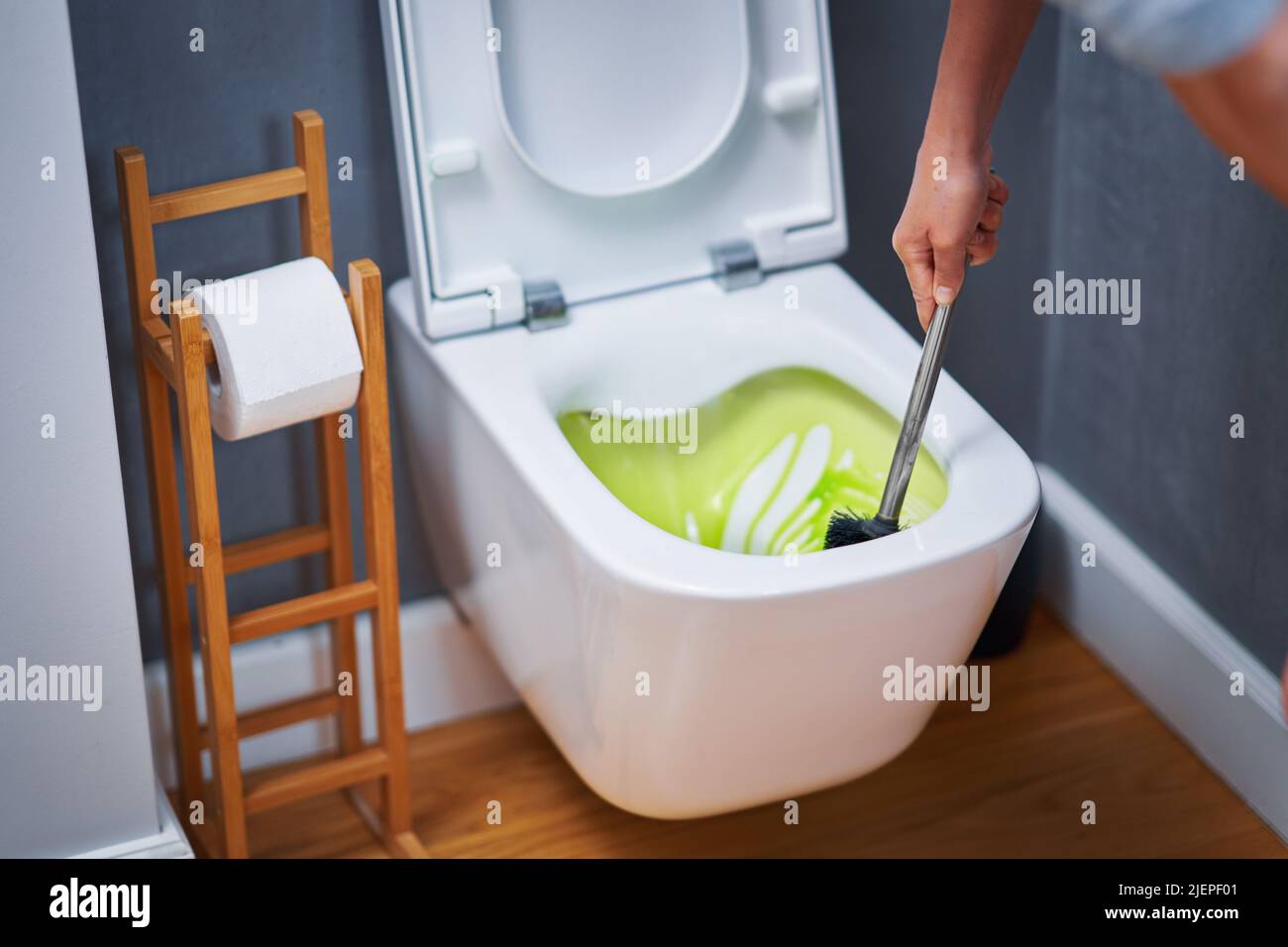Picture of cleaning toilet seat with chemicals Stock Photo