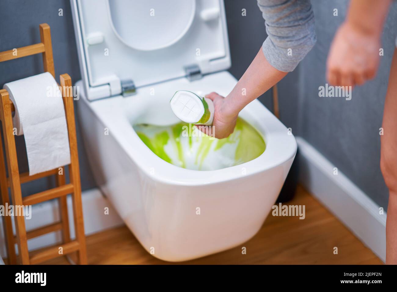 Picture of cleaning toilet seat with chemicals Stock Photo