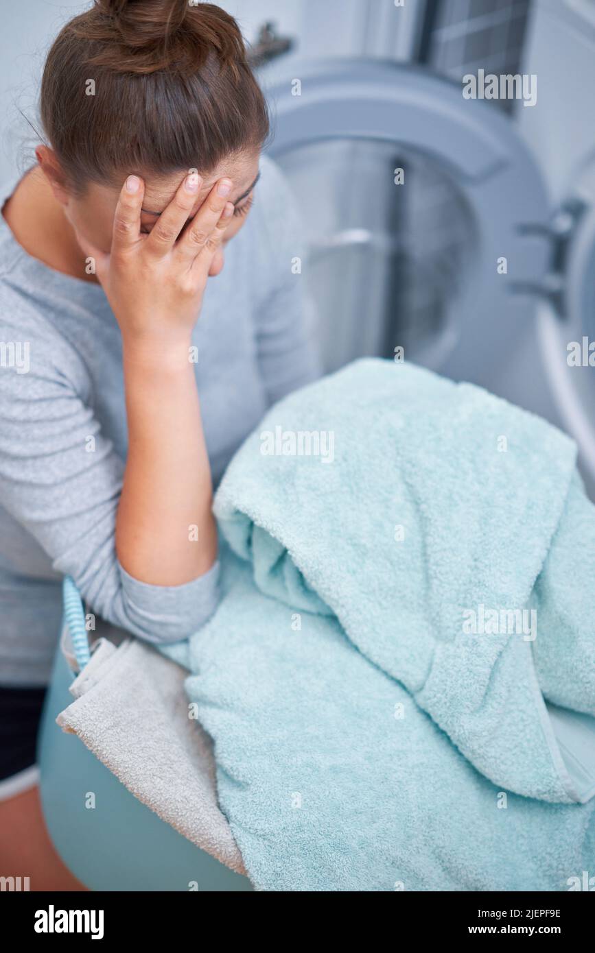 Picture of young woman making laundry work Stock Photo Alamy