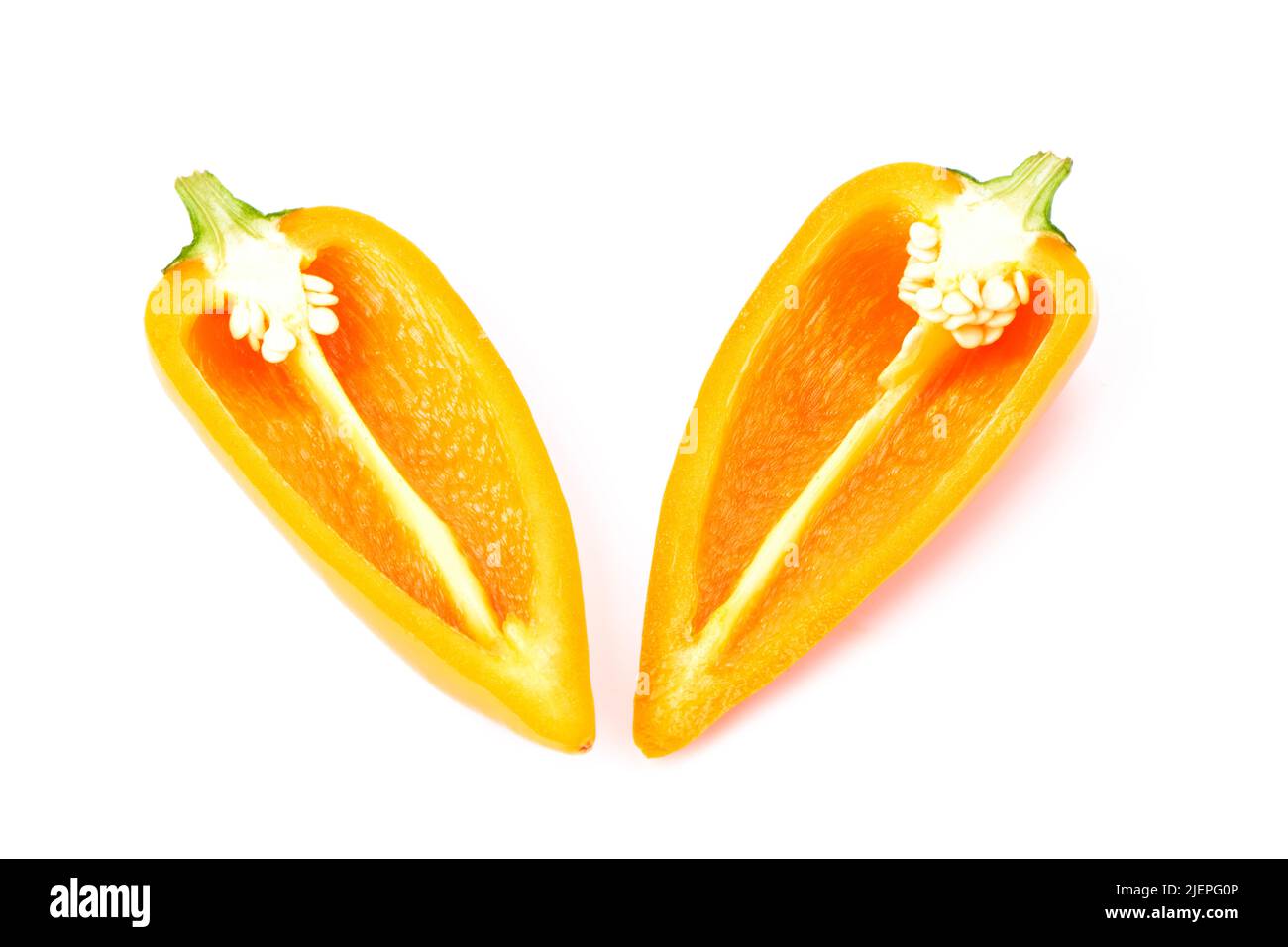 Tasty mini orange bell pepper cut in half. Tasty Vegetables. Healthy and organic food Stock Photo