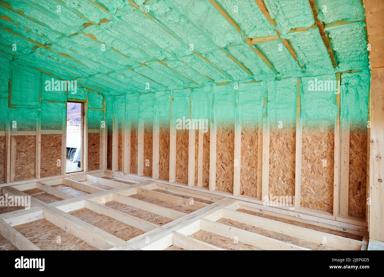 Photo collage before and after thermal insulation room in wooden frame house in Scandinavian style barnhouse. Comparison of walls sprayed by polyurethane foam. Construction and insulation concept. Stock Photo