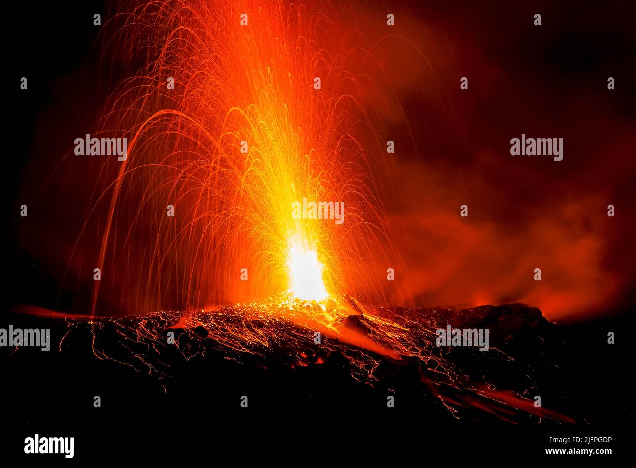Lava bombs erupt from multiple vents at this volcano at night. This