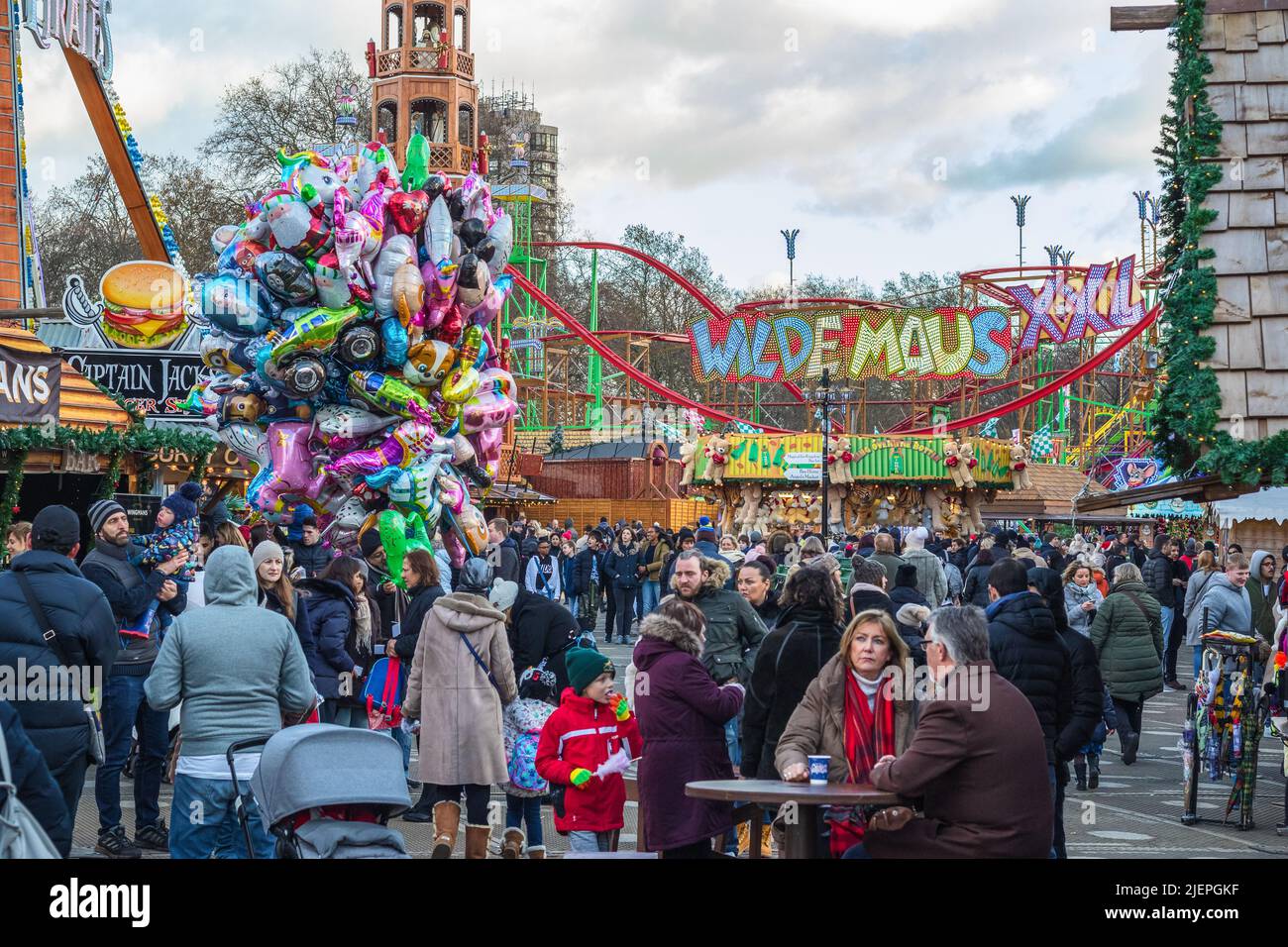 London, UK - 2 December, 2021 - Crowds of people enjoying Christmas funfair Hyde Park Winter Wonderland Stock Photo