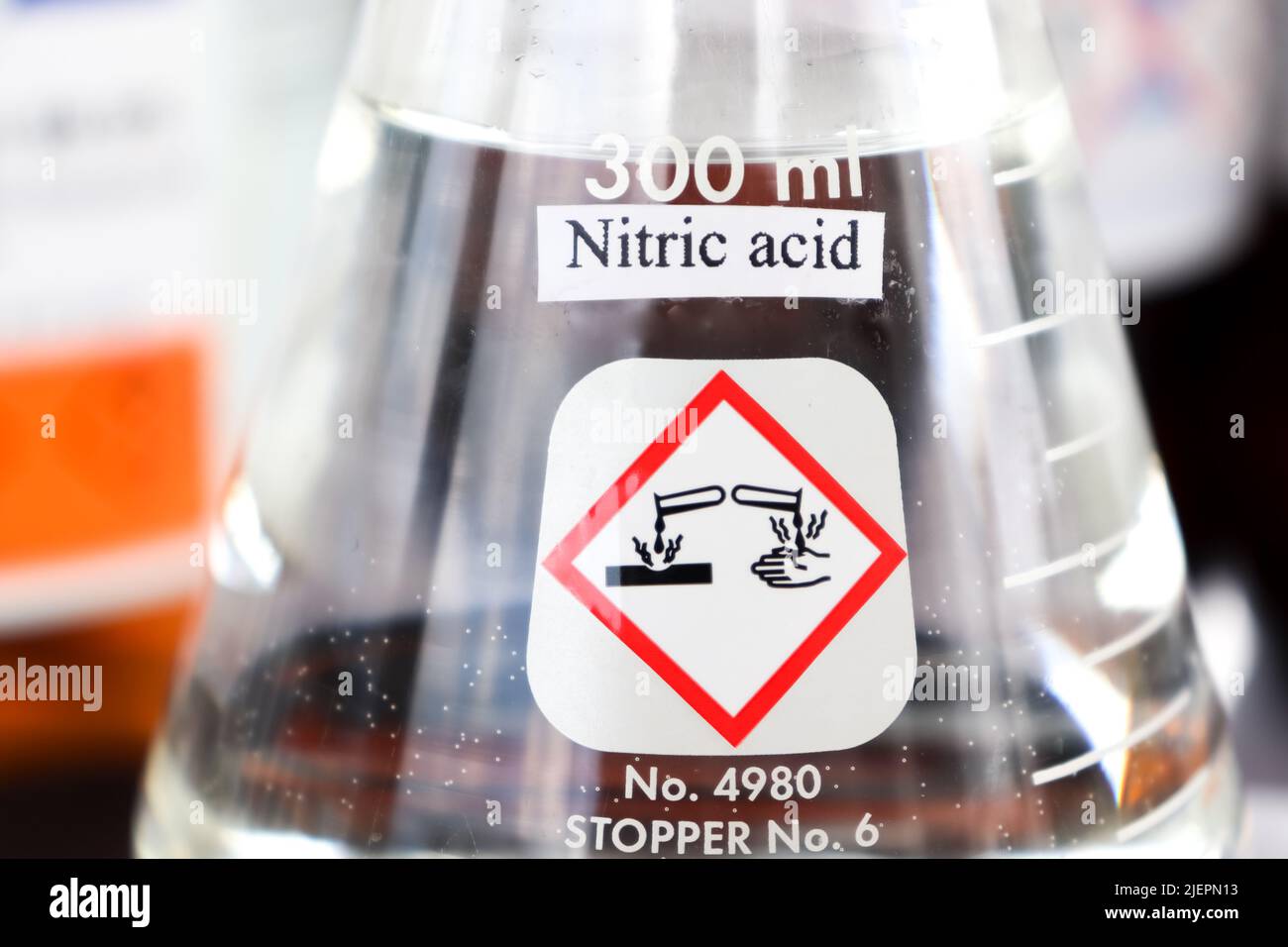 Nitric acid in glass, chemical in the laboratory and industry Stock Photo