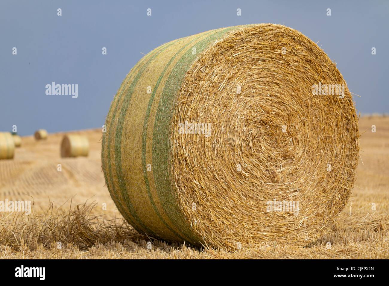 Hay bale on a stormy morning Stock Photo - Alamy