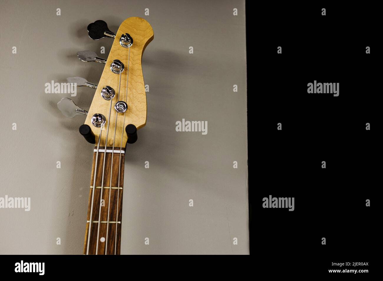 an element of a classic wooden guitar with four strings Stock Photo Alamy