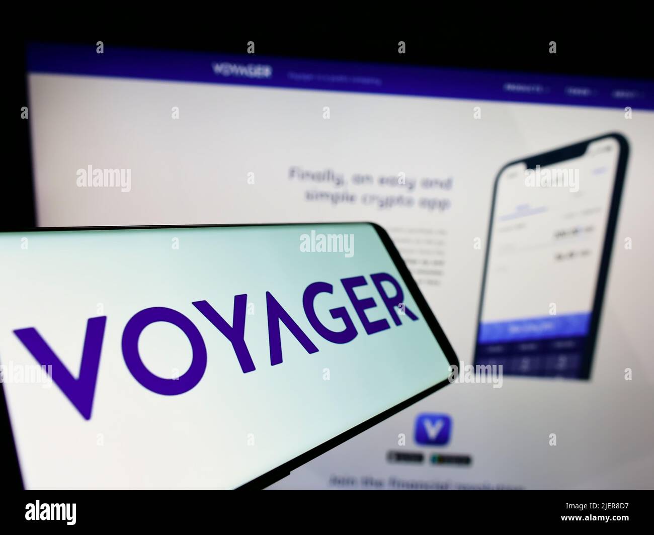 Mobile phone with logo of US cryptocurrency company Voyager Digital LLC on screen in front of business website. Focus on center of phone display. Stock Photo