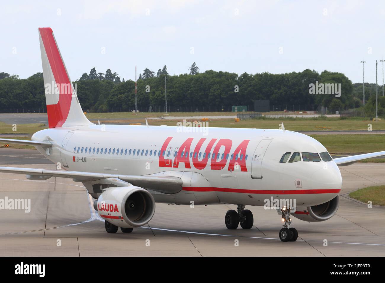 Lauda Air, Airbus A320 9H-LMI, arriving at Stansted Airport, Essex, UK Stock Photo