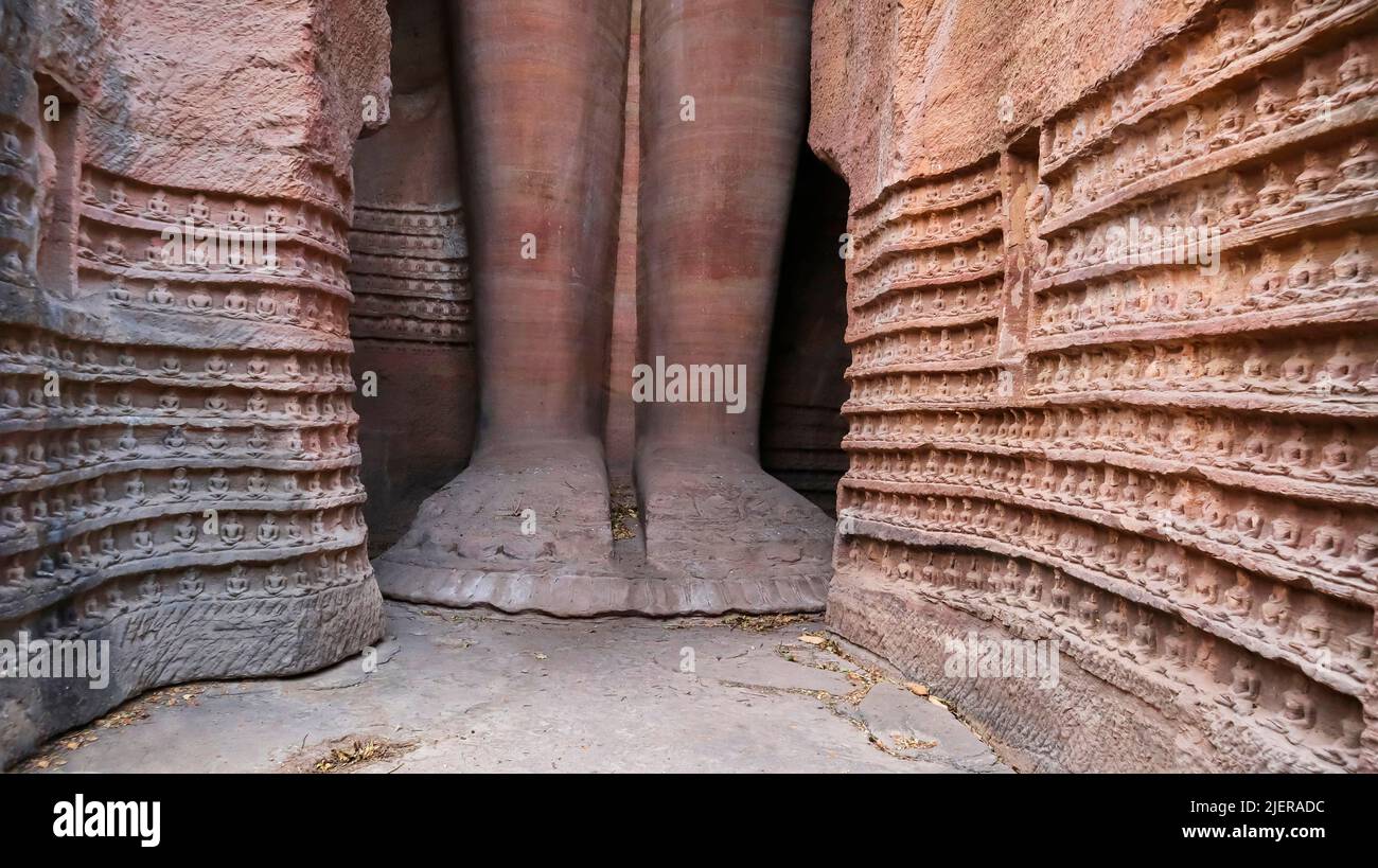 Feet of Standing colossus Rock-cut Jain sculpture of 57 Feet the largest of the group at Sidhhachal Caves, Gwalior Fort, Madhya Pradesh, India. Urvai Stock Photo