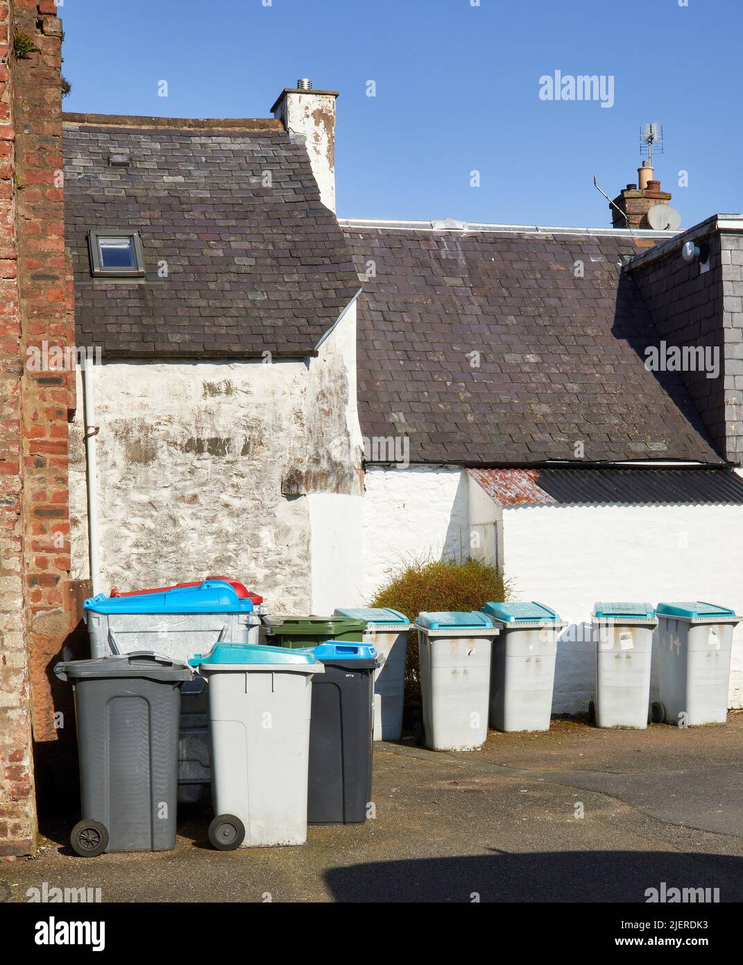In a back street, a neat row of rubbish bins in Moffat Stock Photo Alamy