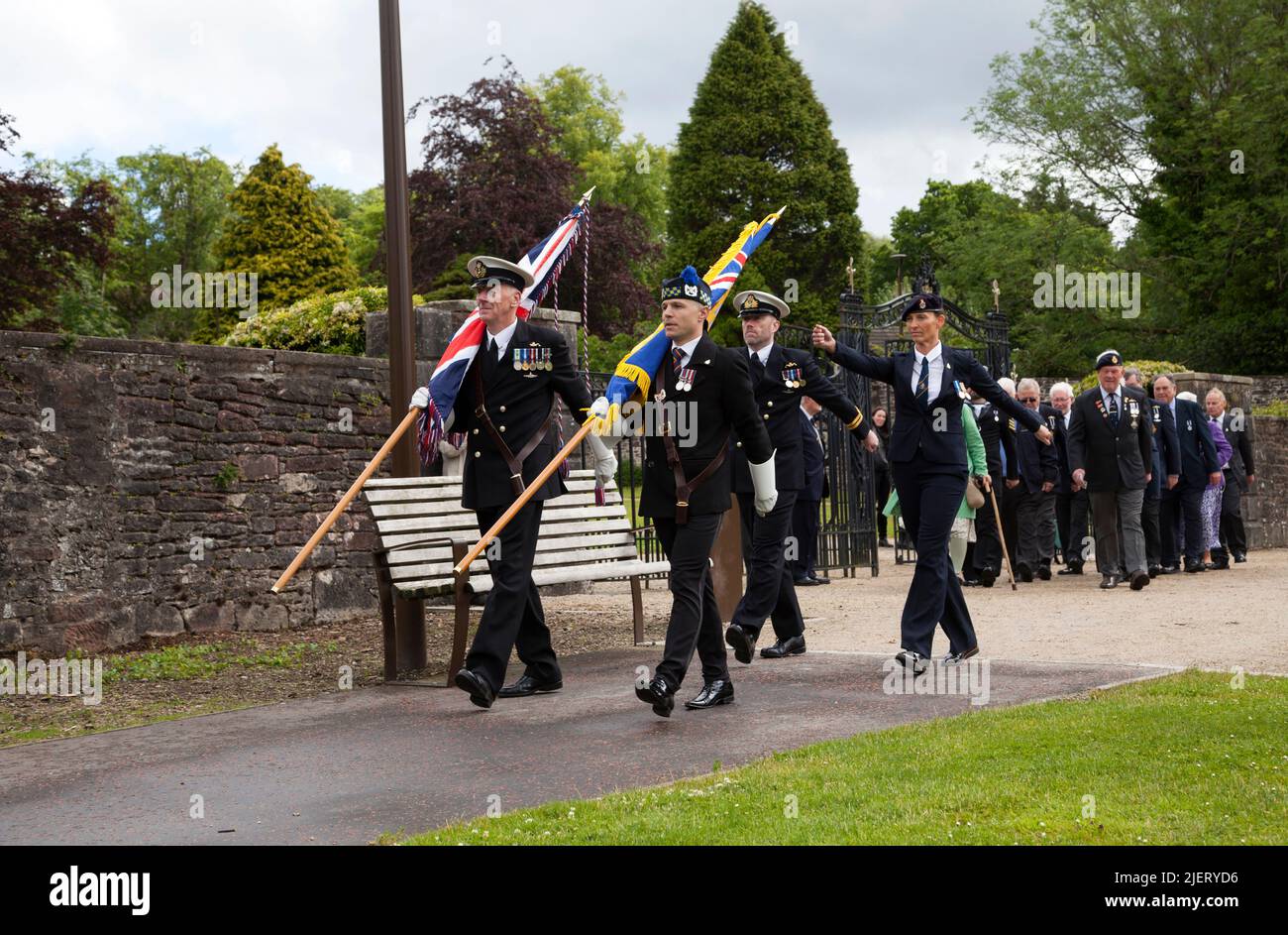 British Legion members marching behind their new Standard. Standard bearer and guard. Helensburgh Branch, Scotland Stock Photo