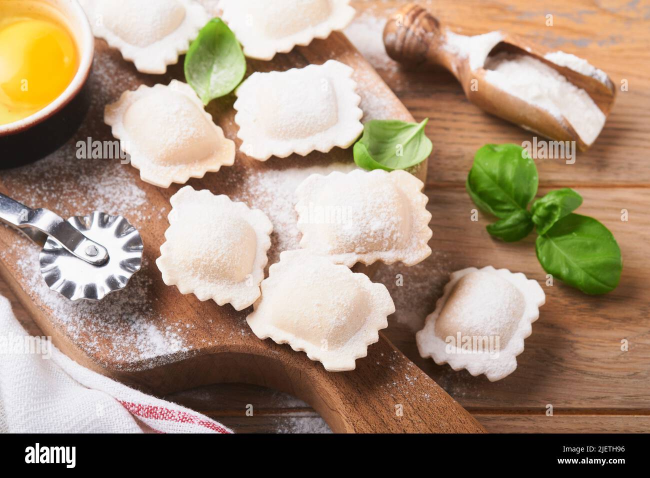 Ravioli Italian food. Tasty homemade pasta ravioli with flour, tomatoes ...