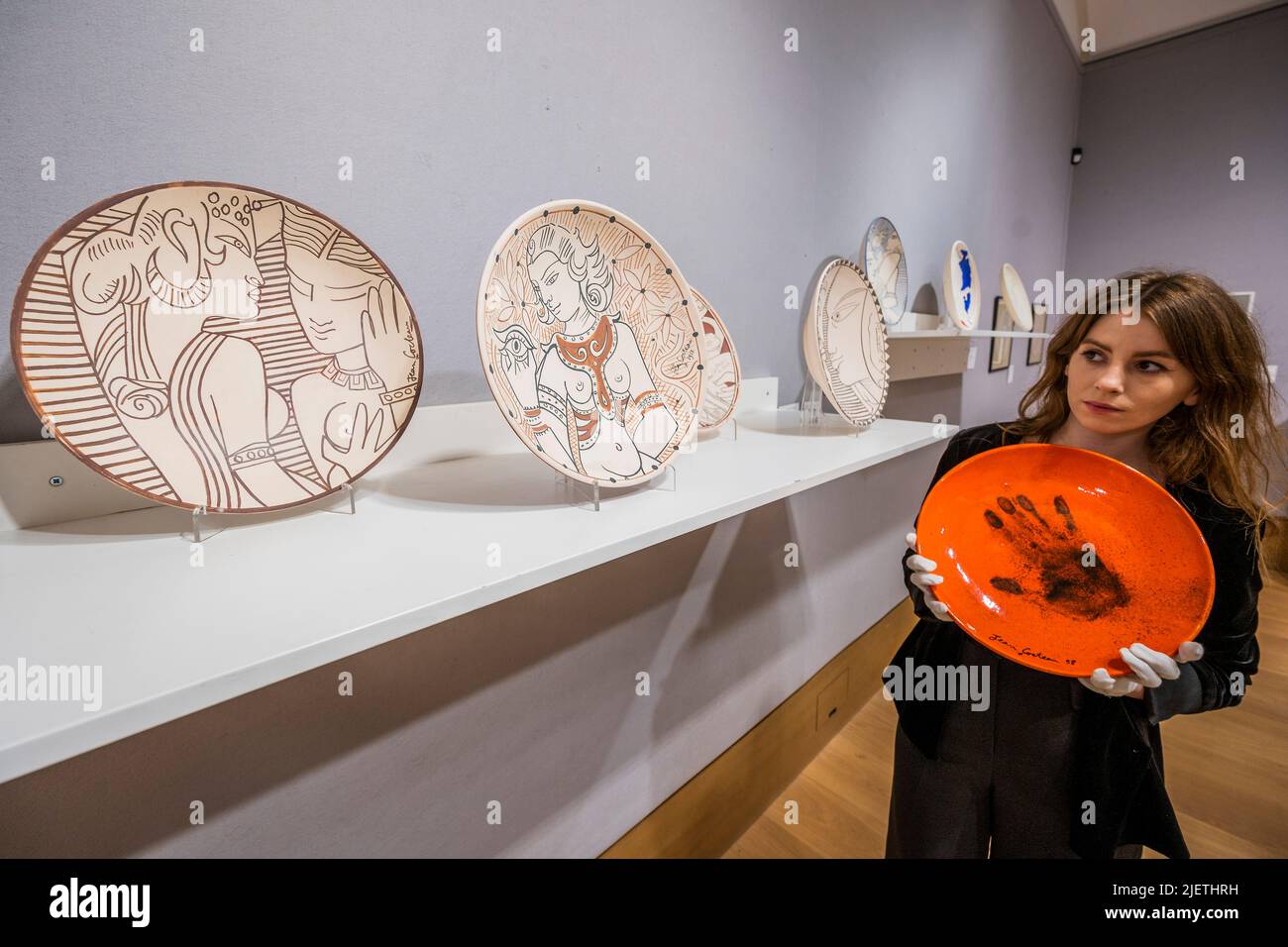 London, UK. 28th June, 2022. Le Main de Poete, Est on request, and other Ceramic plates - A preview of Bonhams' Jean Cocteau and the Madeline-Jolly Workshop sale in New Bond Street. The sale takes place on 29 September 2022, in Paris. Credit: Guy Bell/Alamy Live News Stock Photo