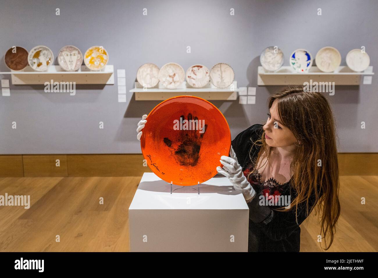London, UK. 28th June, 2022. Le Main de Poete, Est on request, and other Ceramic plates - A preview of Bonhams' Jean Cocteau and the Madeline-Jolly Workshop sale in New Bond Street. The sale takes place on 29 September 2022, in Paris. Credit: Guy Bell/Alamy Live News Stock Photo