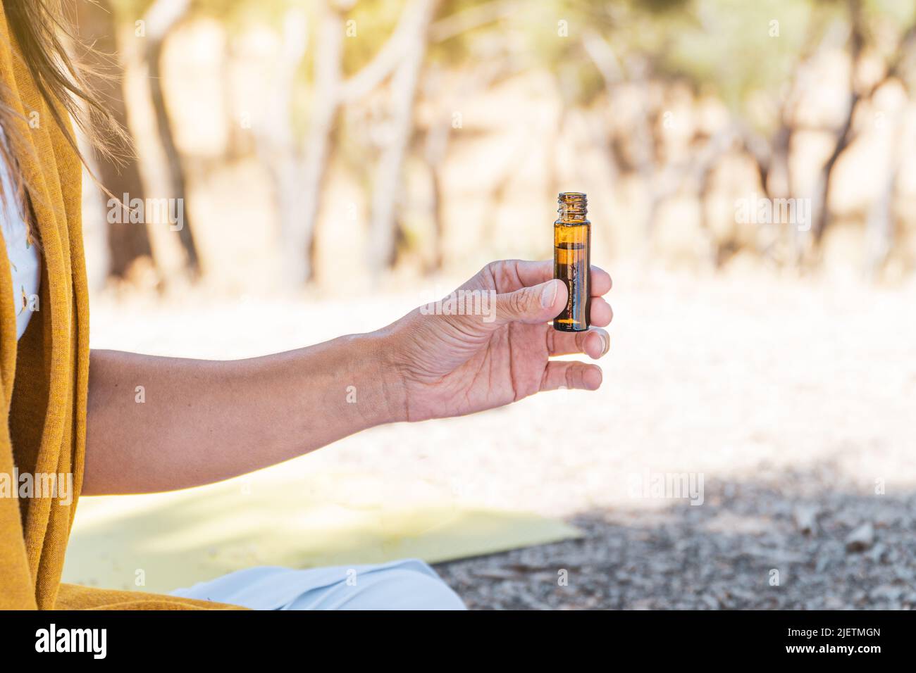woman testing aromatherpy oils on a summertime mindfulness ritual. healthy life concept. summer solstice. Stock Photo