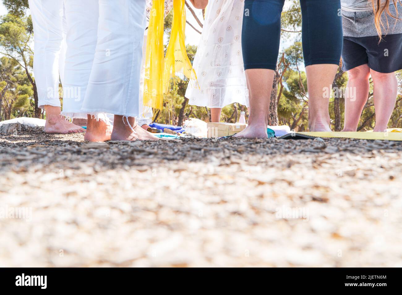 women meditating on a circular mindfulness ritual. healthy life concept. summer solstice. Stock Photo