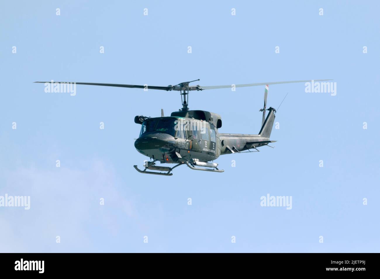 Italian Air Force Agusta AB-212ICO (MM86113), stationed in Malta on agreement with the Italian Govt. overflies the airfield. Stock Photo