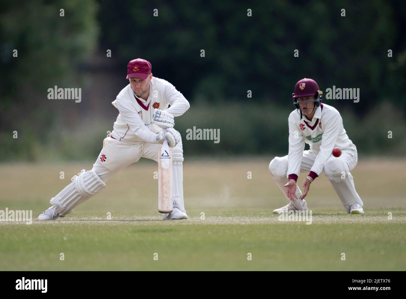 Cricket batsman playing shot Stock Photo