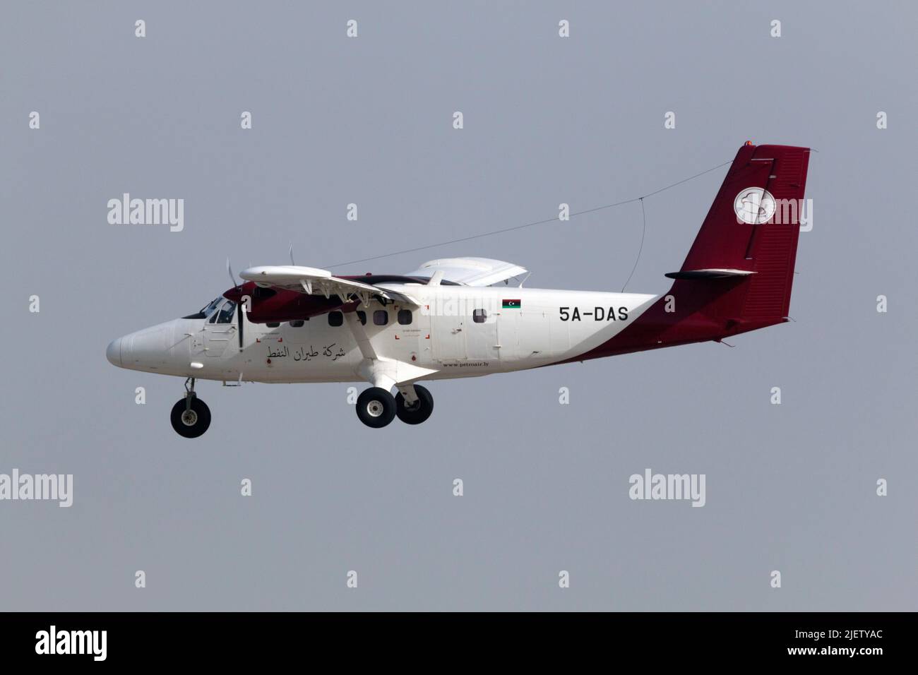 Petro Air De Havilland Canada DHC-6-300 Twin Otter (REG: 5A-DAS) on short finals runway 31, arriving from Libya. Stock Photo