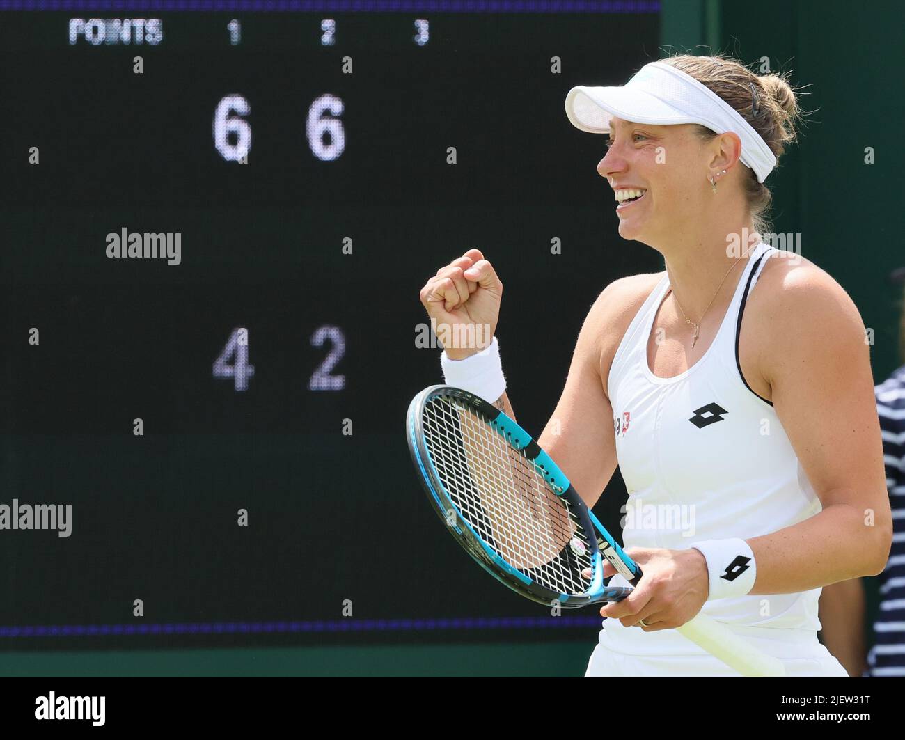 London, UK. 28th June, 2022. Belgian Yanina Wickmayer celebrates after  winning a first round game in the women's singles tournament against  Chinese Zhu (WTA 98) at the 2022 Wimbledon grand slam tennis