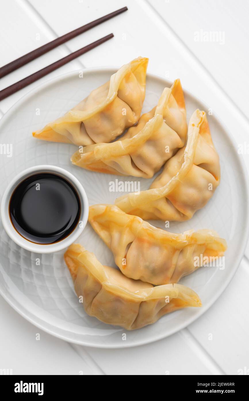Chinese dumplings and soy sauce on a plate. Top view Stock Photo Alamy