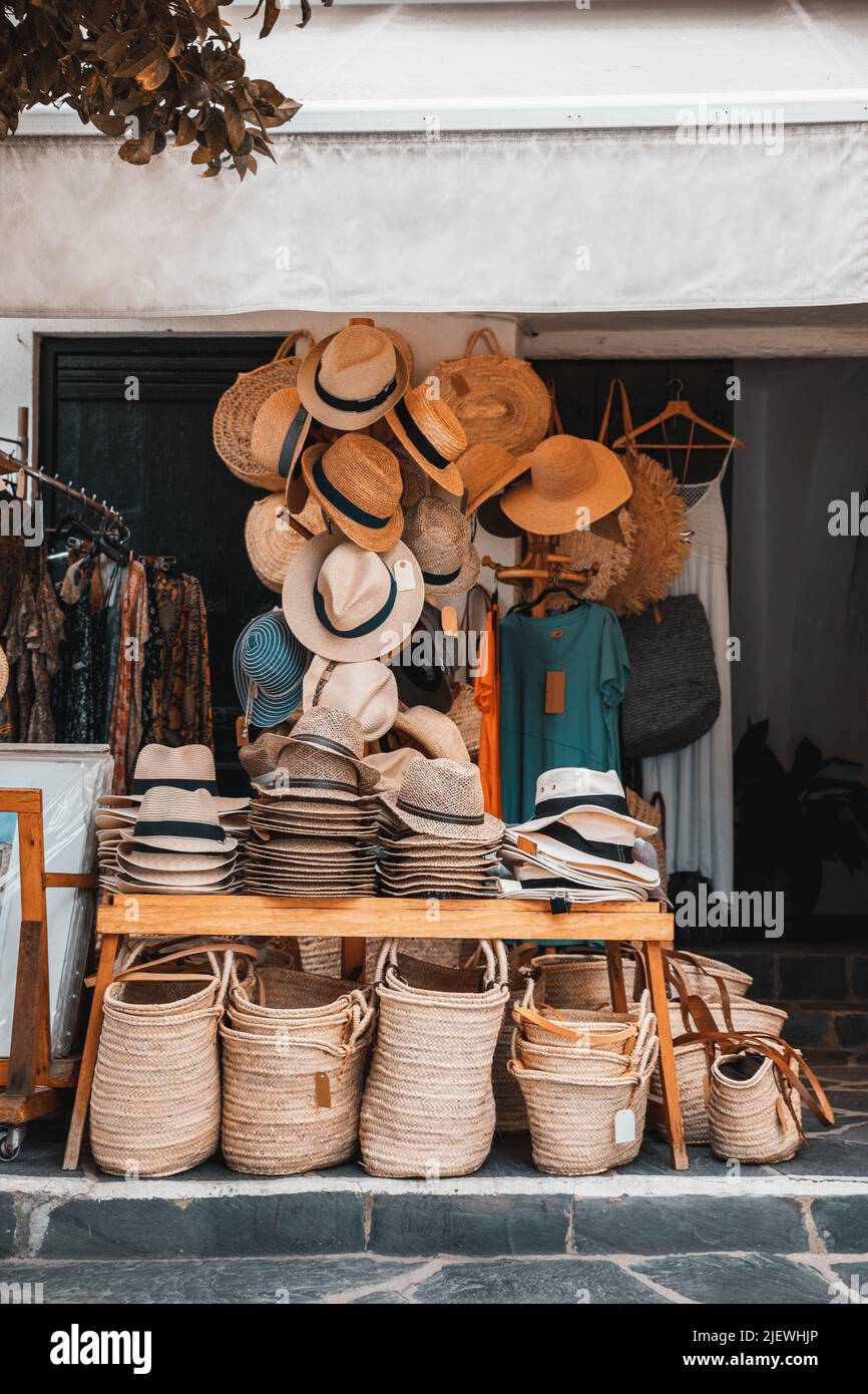 Traditional village store with hats and straw bags, baskets and clothes