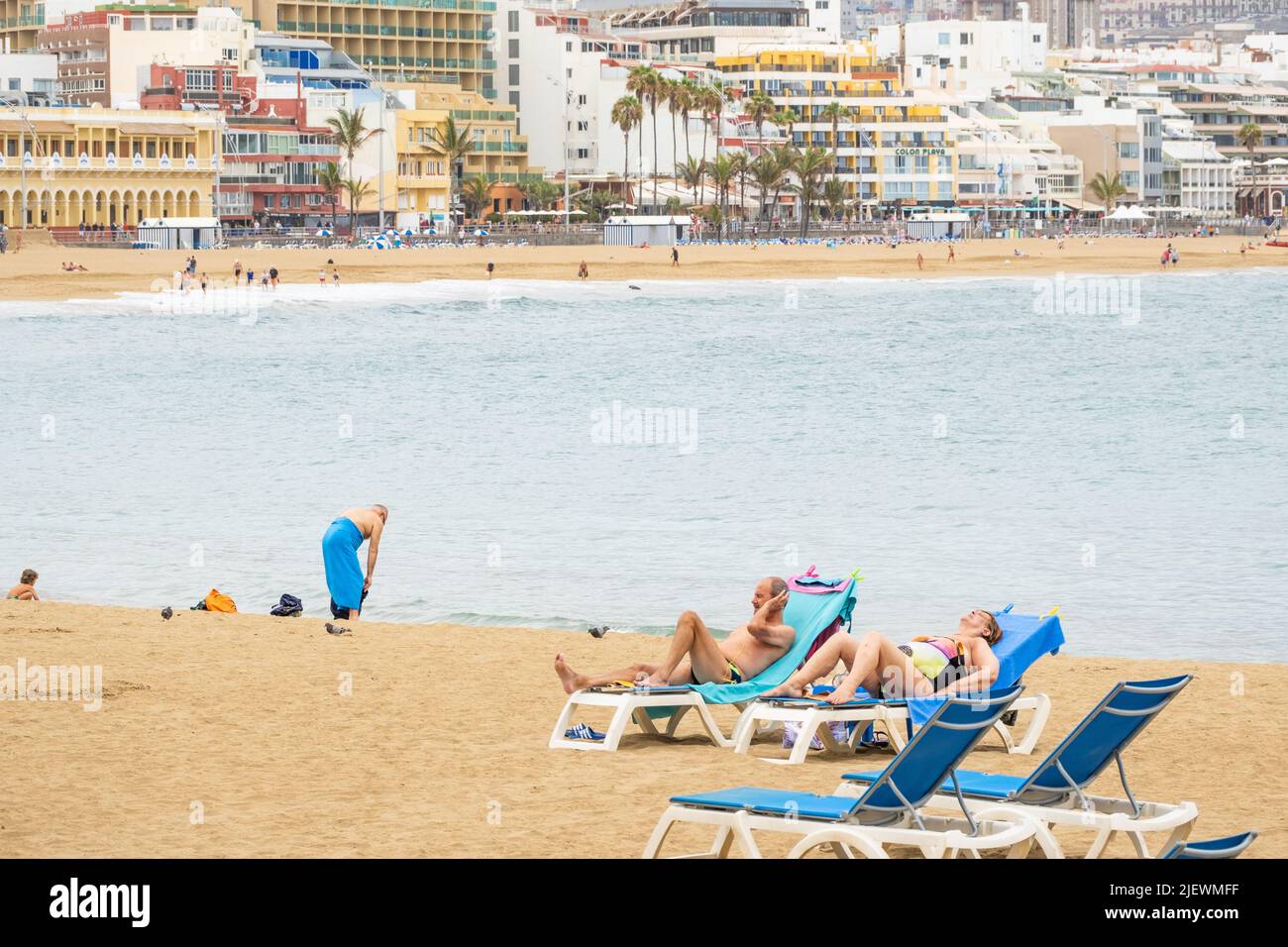 Las Palmas, Gran Canaria, Canary Islands, Spain. 28th June, 2022. Tourists, many from the UK, bask on the city beach in Las Palmas on Gran Canaria. Credit: Alan Dawson/ Alamy Live News. Stock Photo